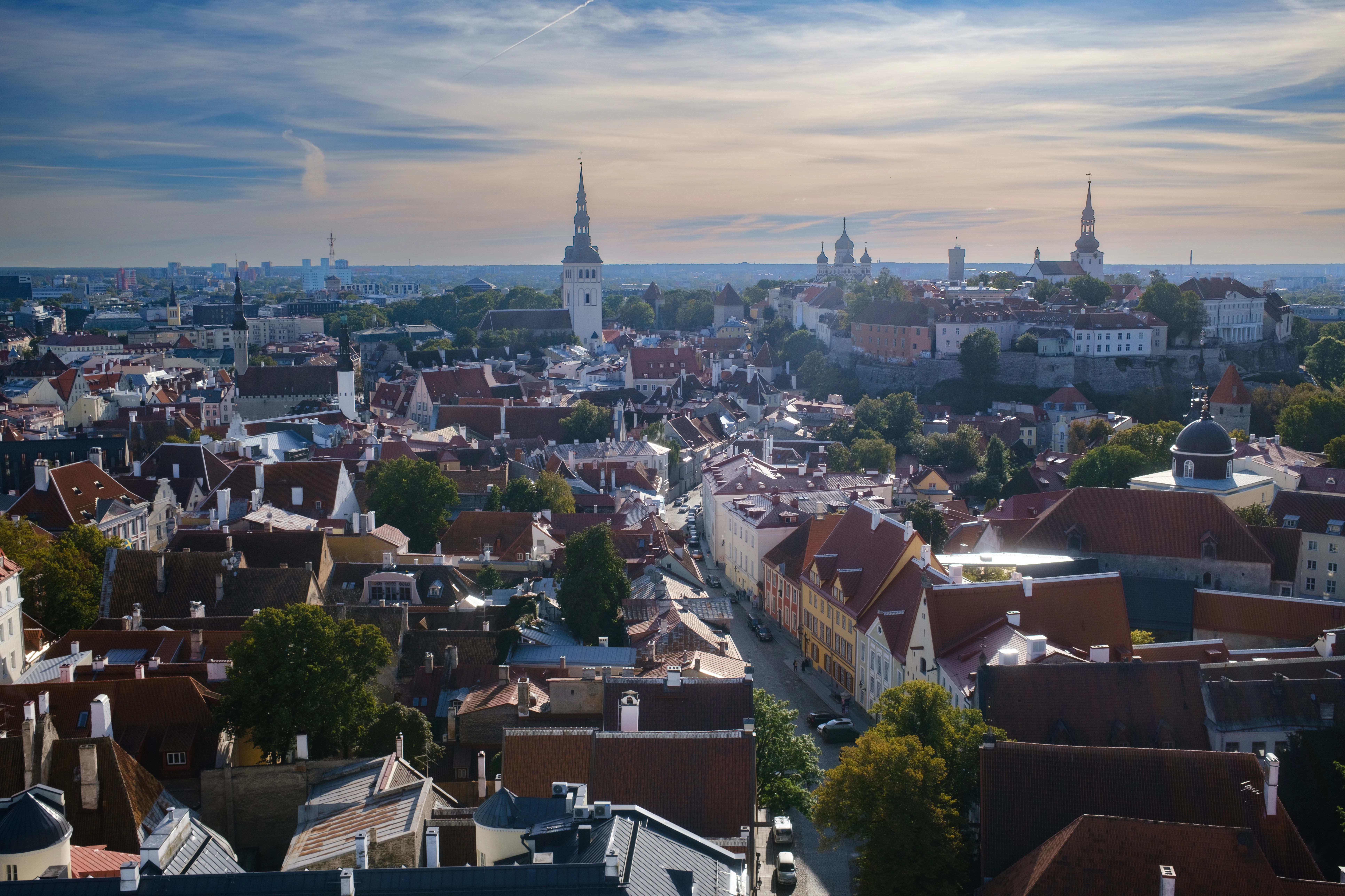 Panoramic view of a historic european city with spires.
