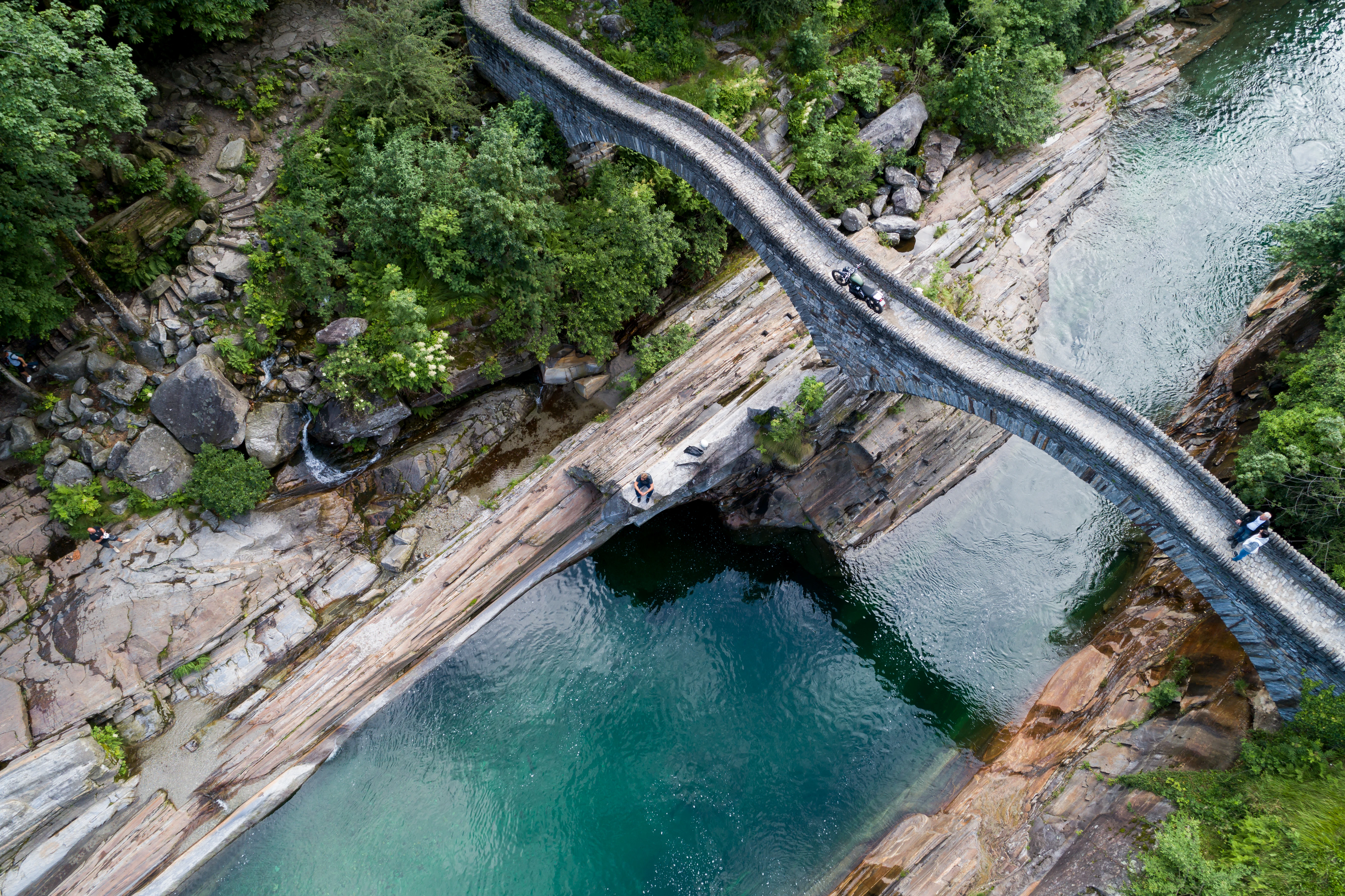 an aerial view of a bridge over a river