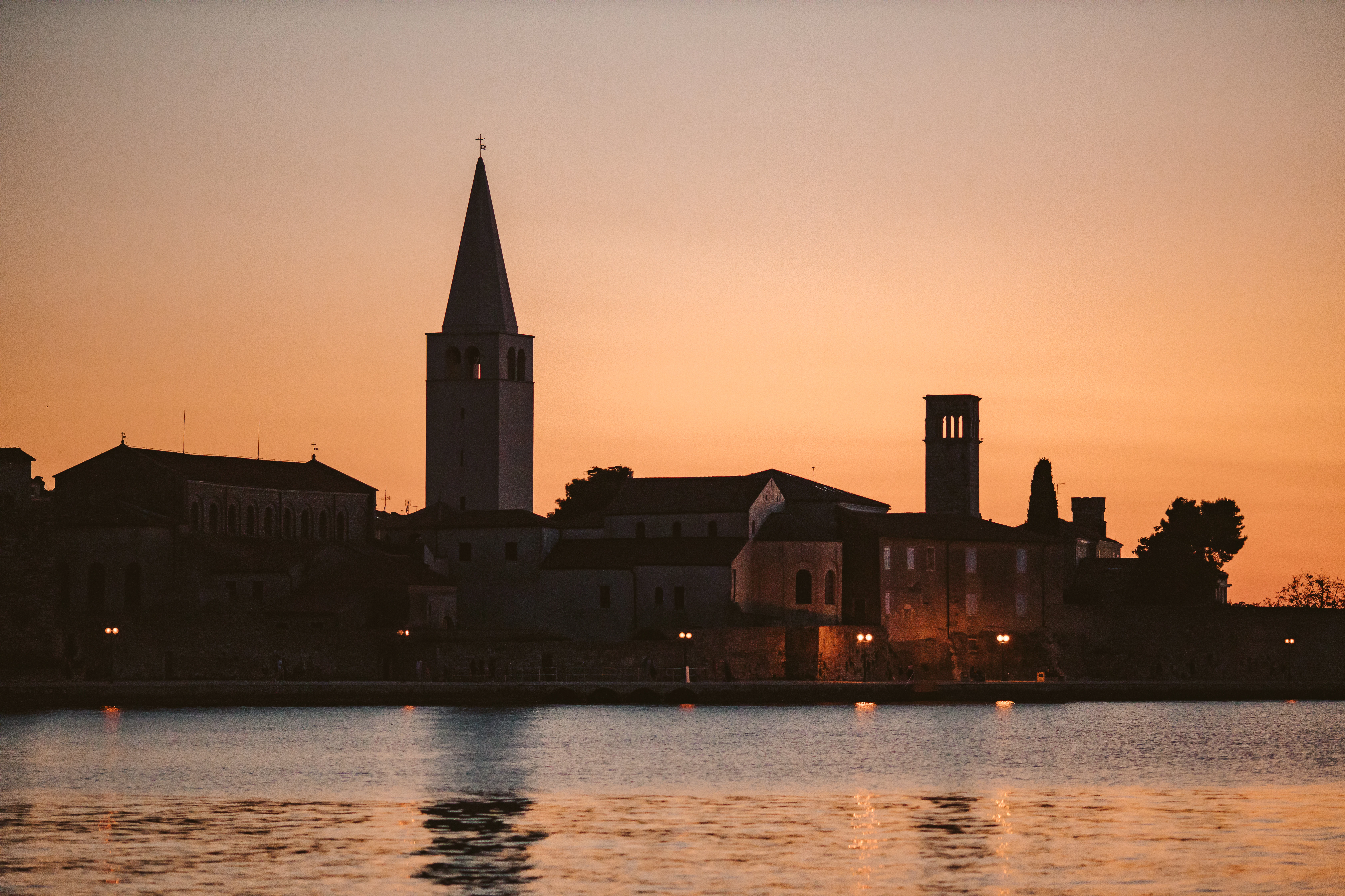 A large body of water with a city in the background