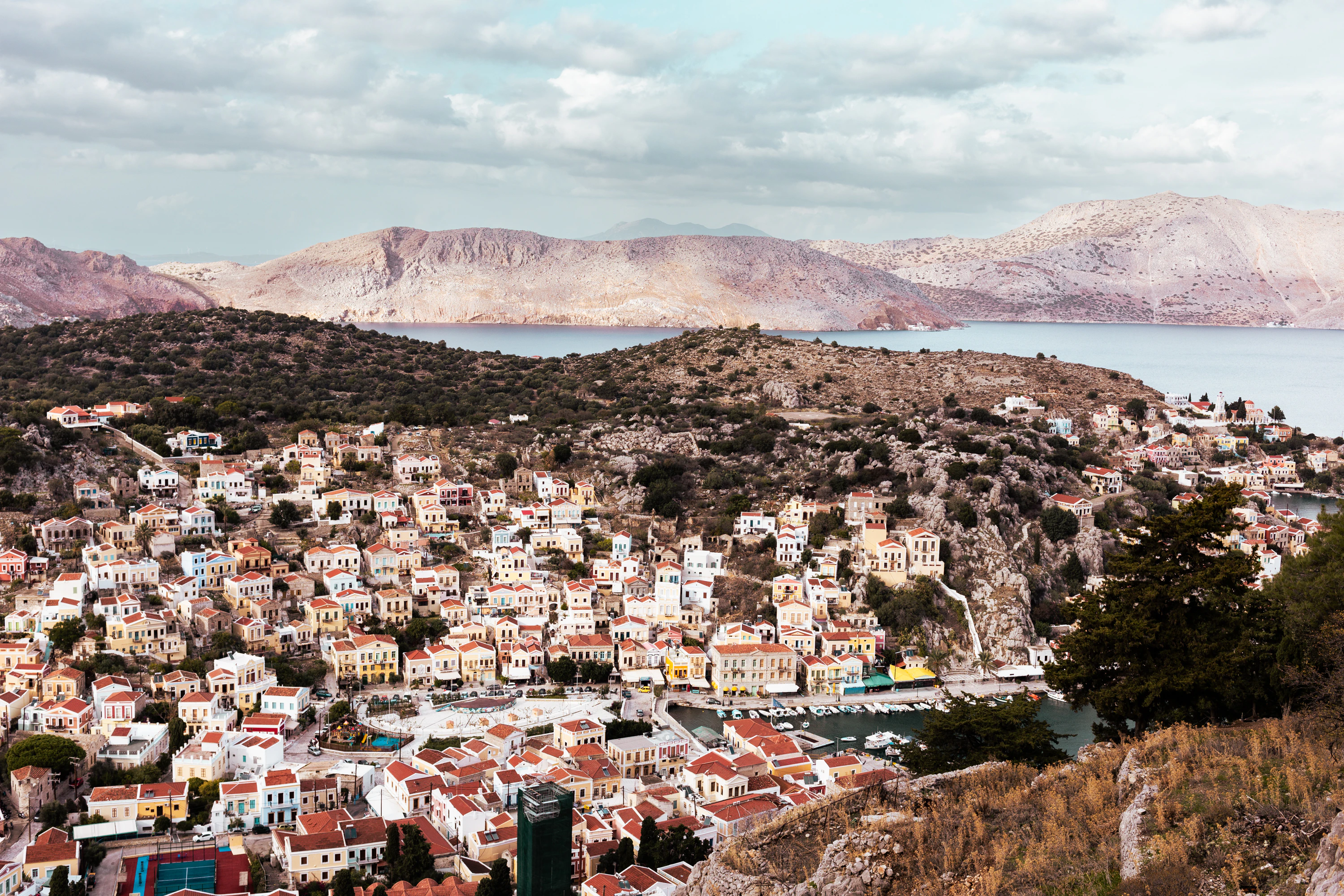 a view of a city with mountains in the background