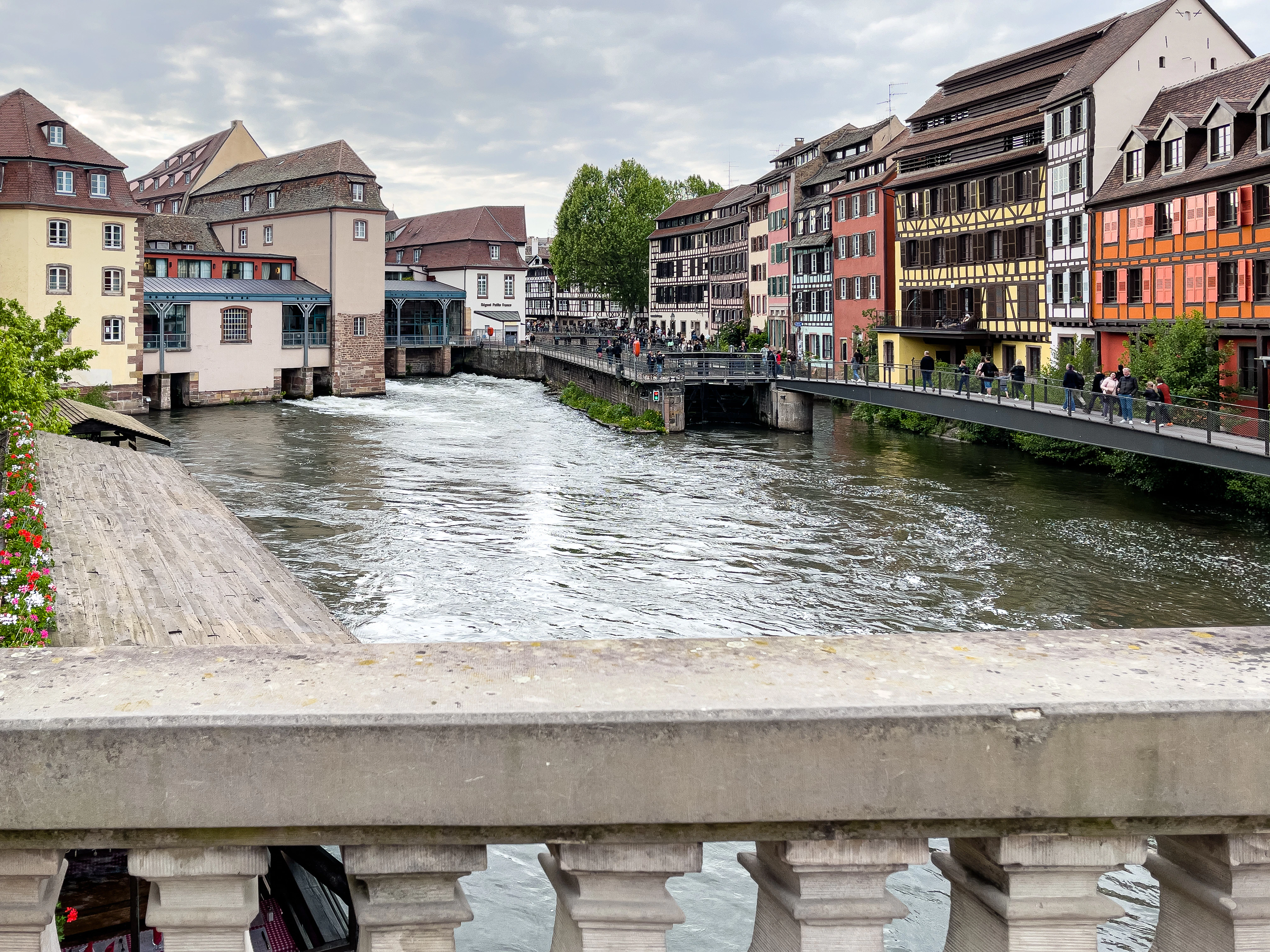 a river running through a city next to tall buildings