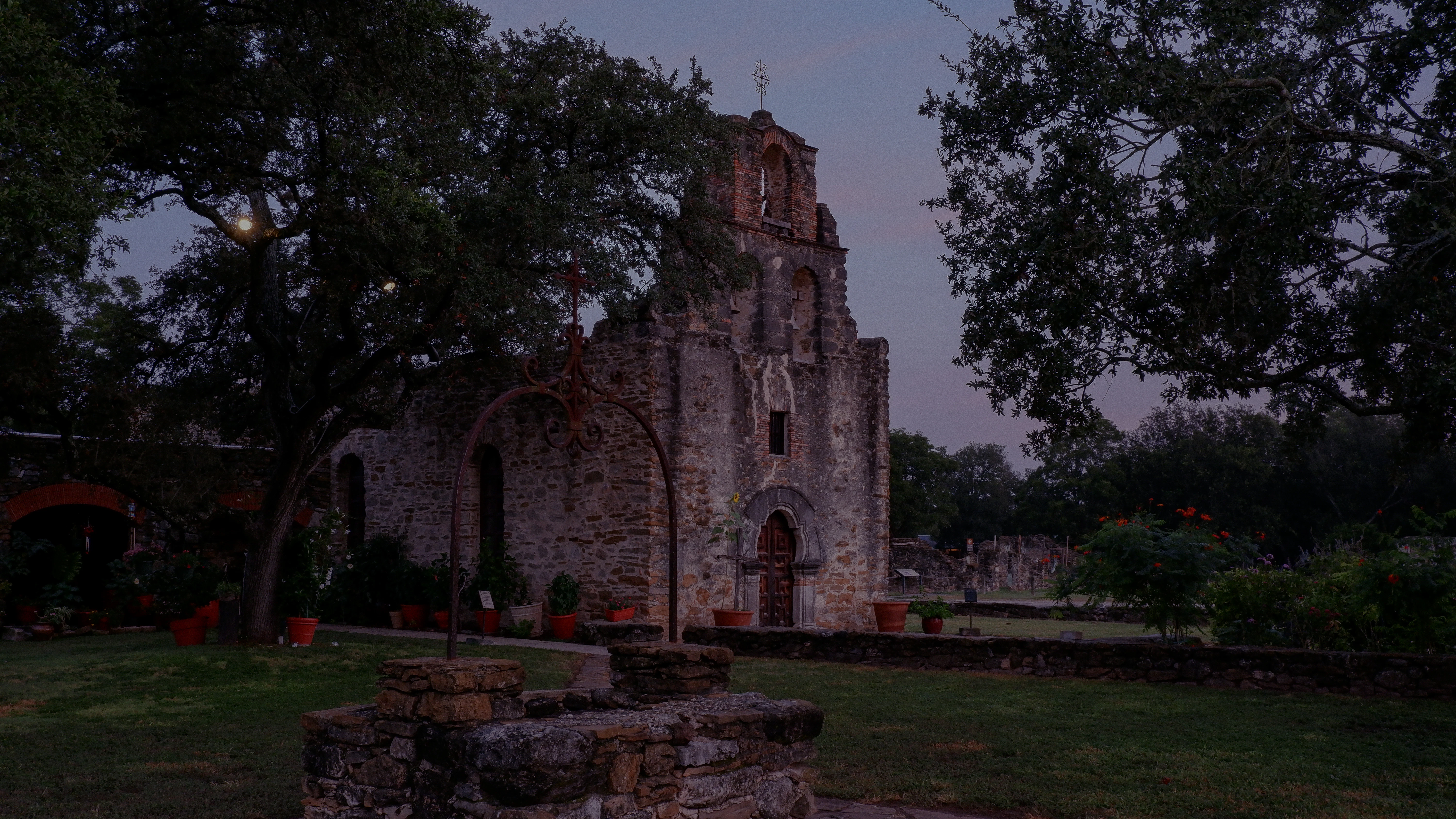 an old stone building with a clock tower