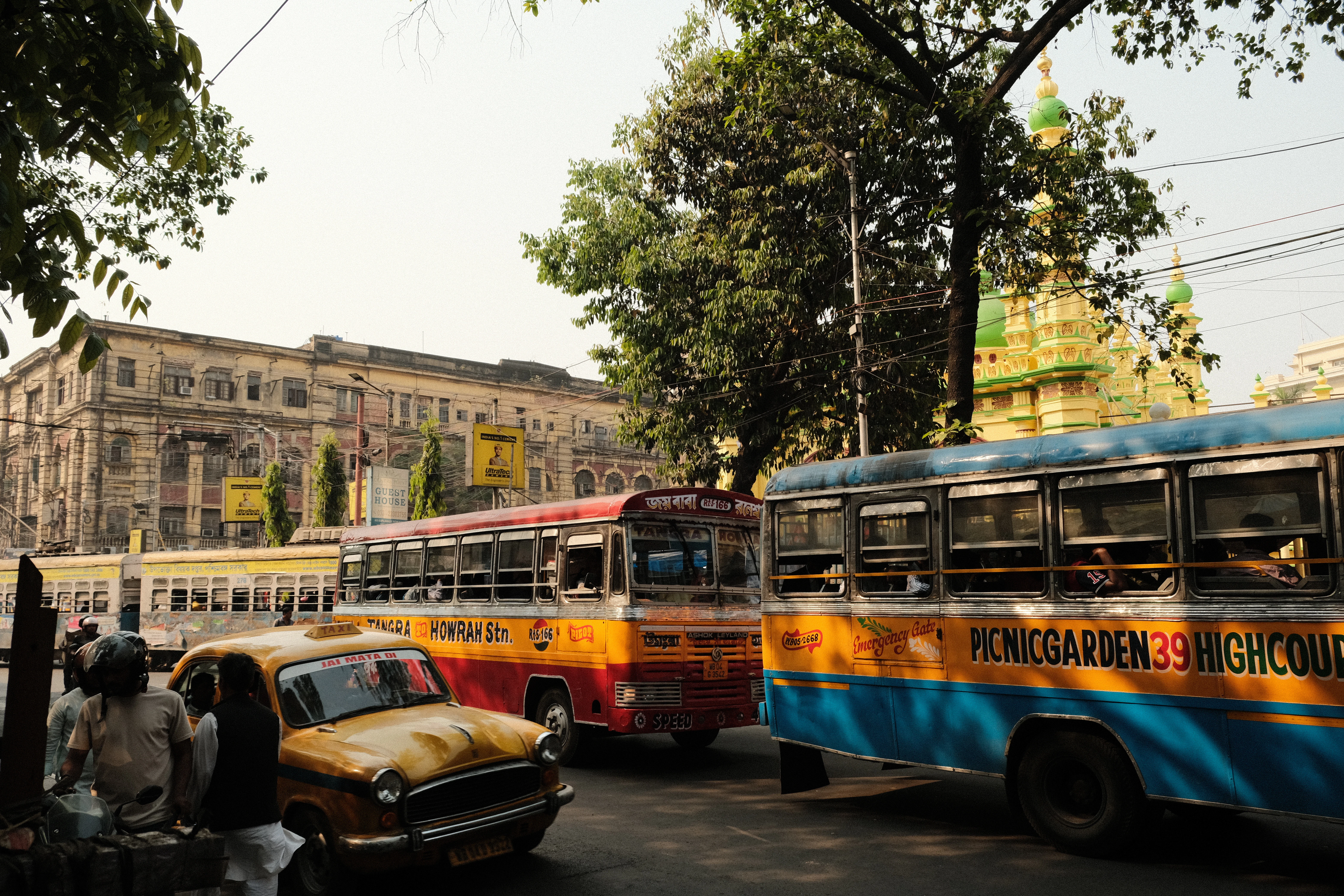a couple of buses that are sitting in the street