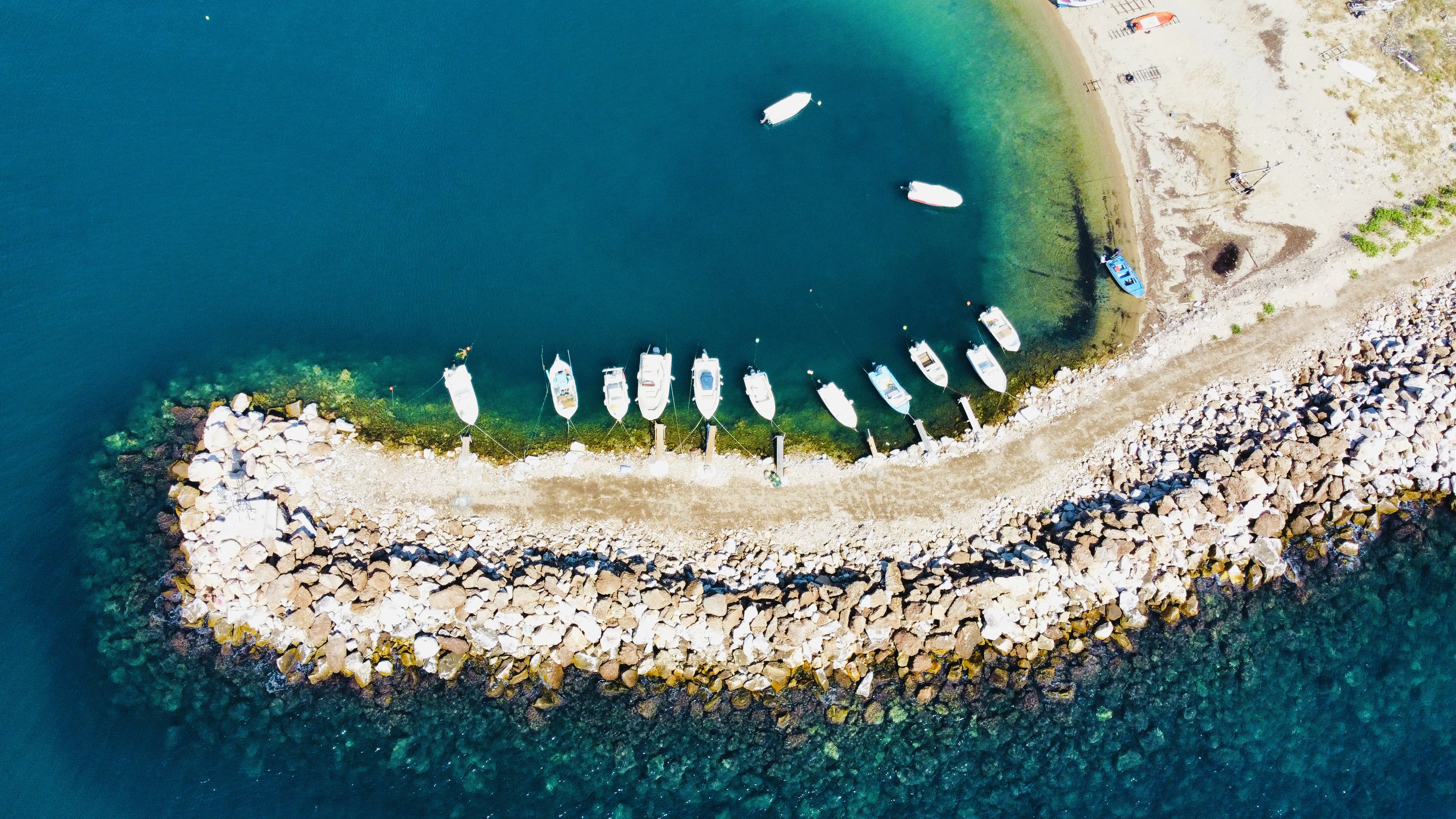 a beach with rocks and a body of water