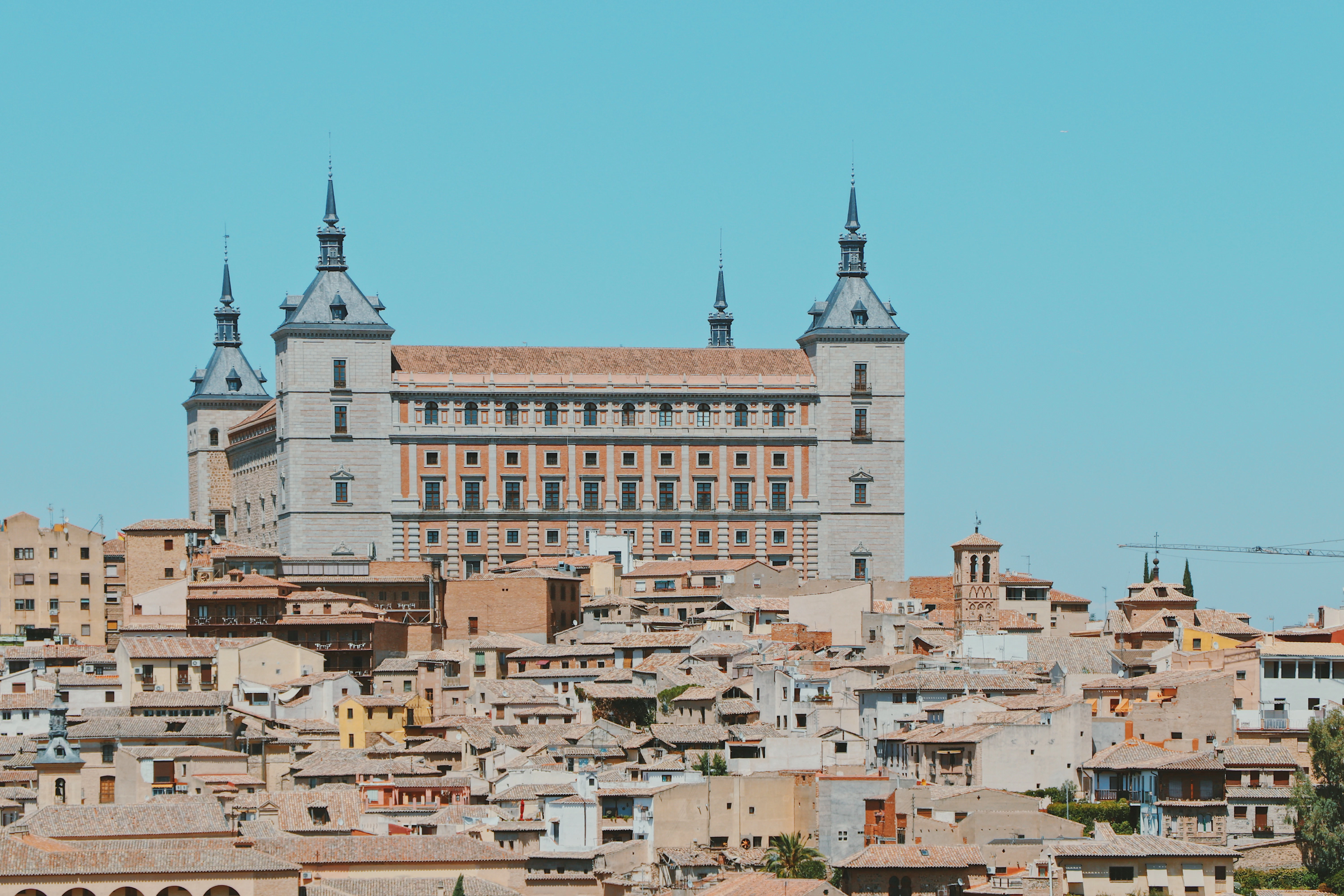 a very tall building with some towers on top of it