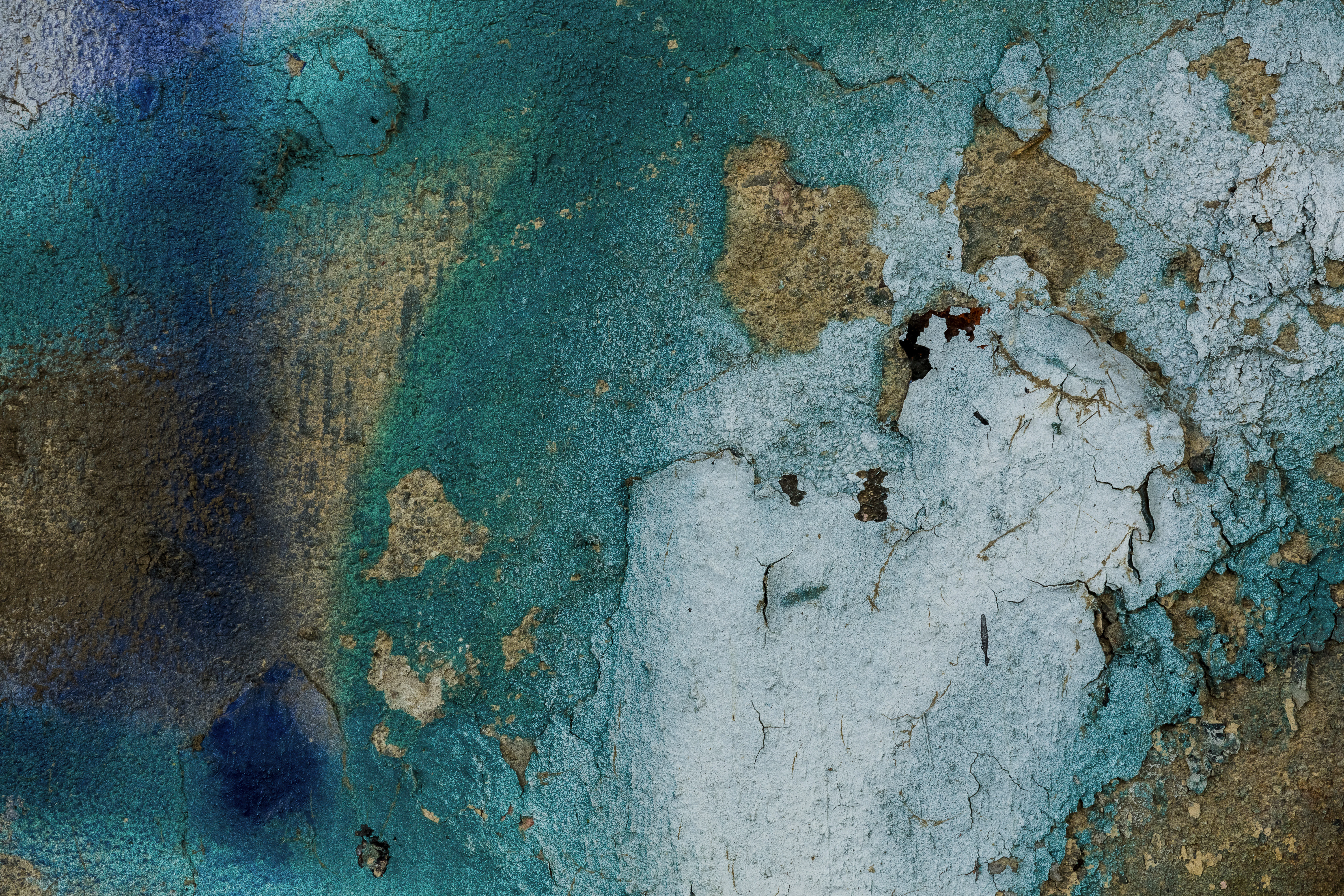 concrete with sprayed blue, teal, and white paint