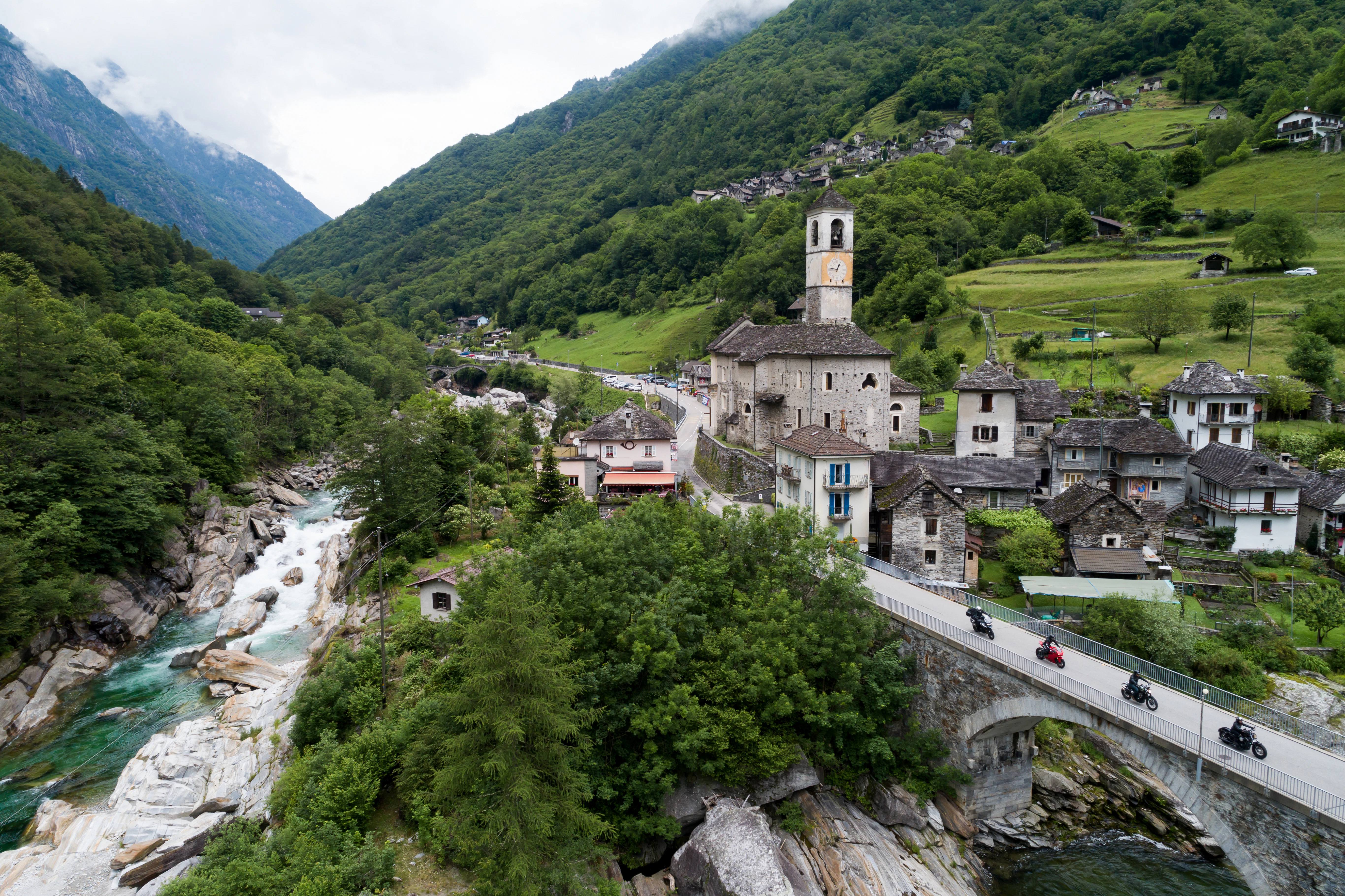 a river running through a lush green valley