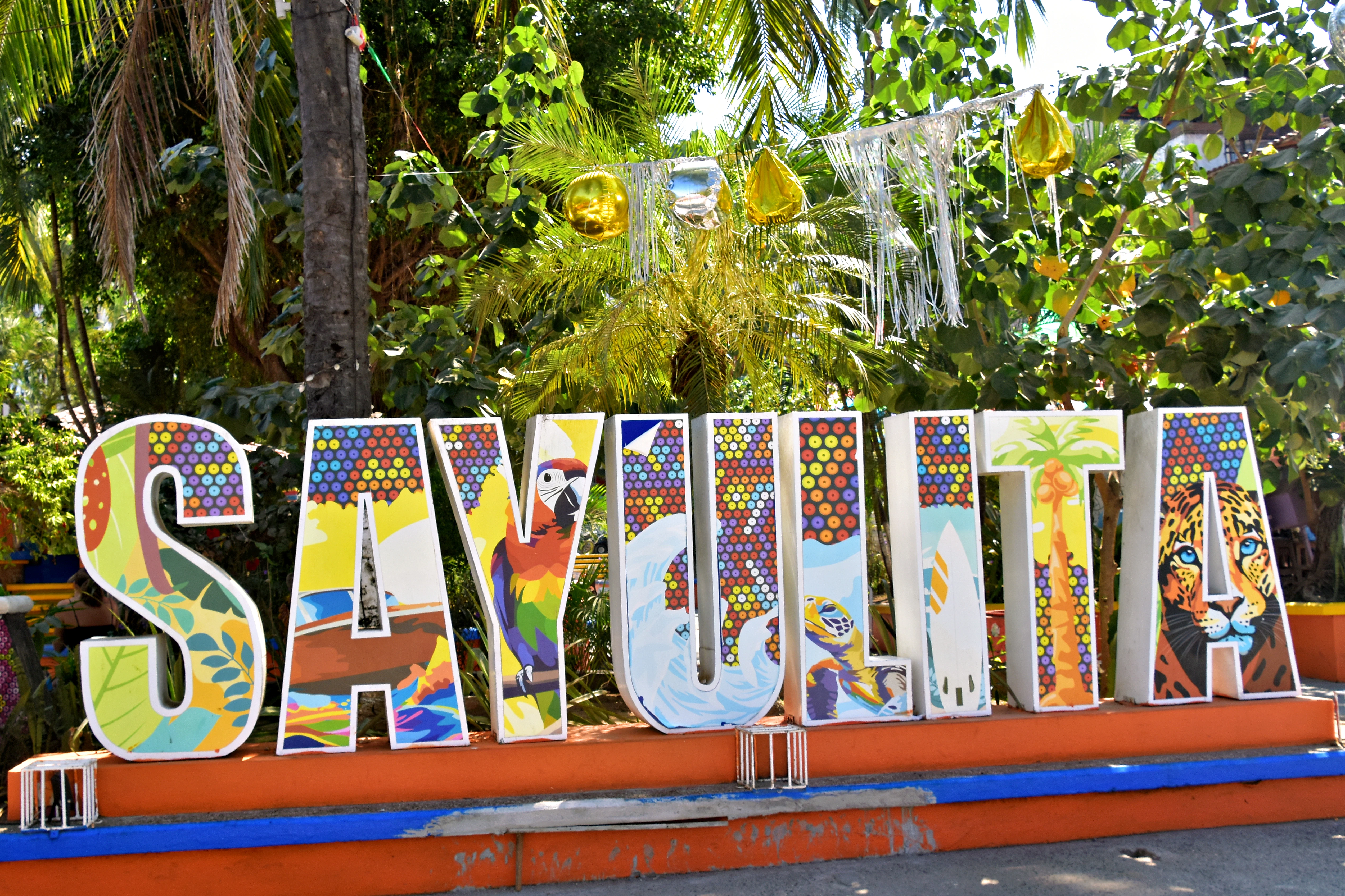 Colorful sayulita sign with tropical decorations