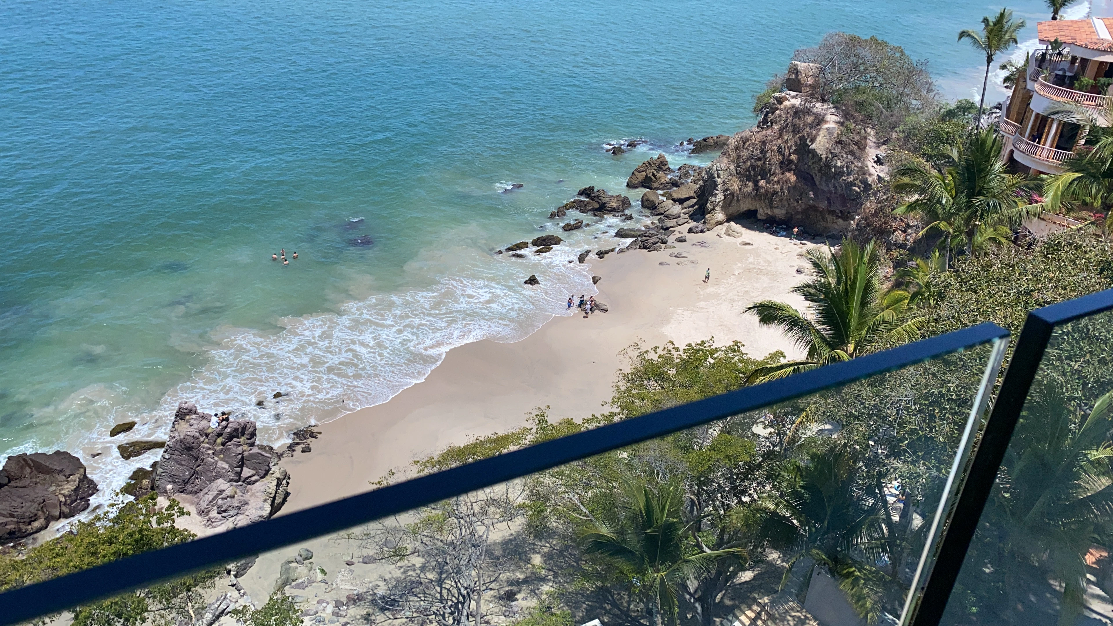a view of a beach from a balcony