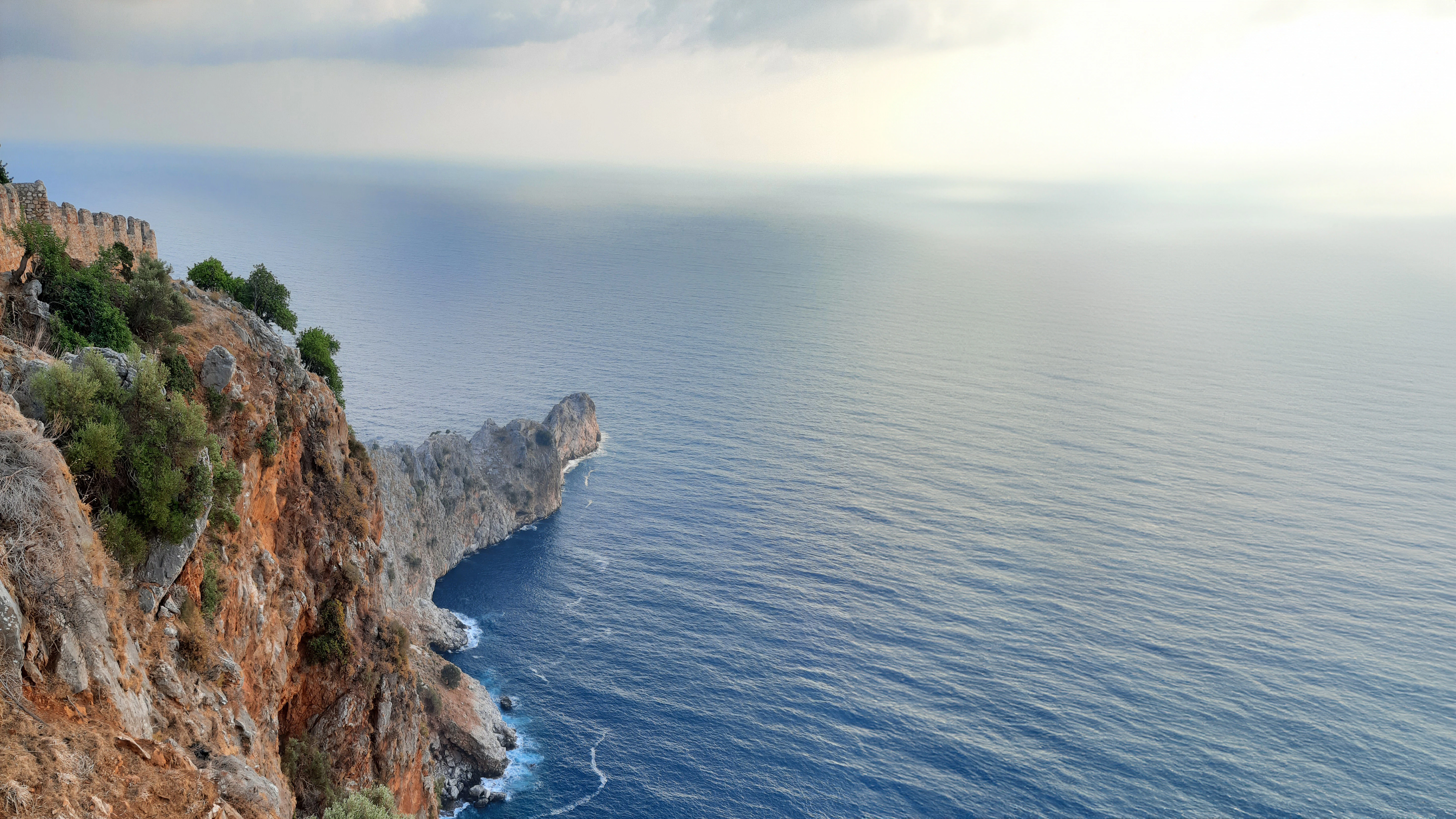 a view of the ocean from the top of a cliff