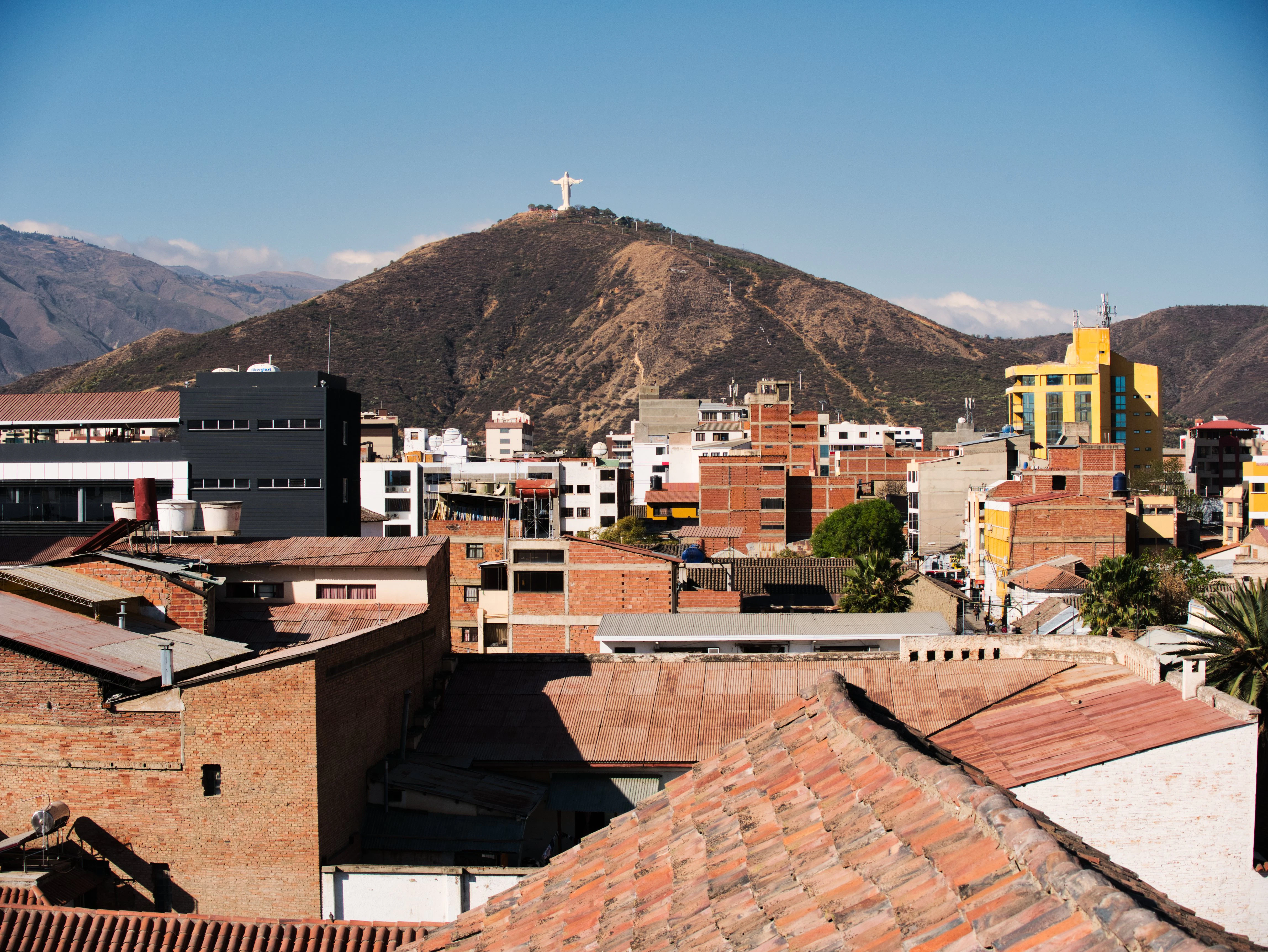 a view of a city with mountains in the background