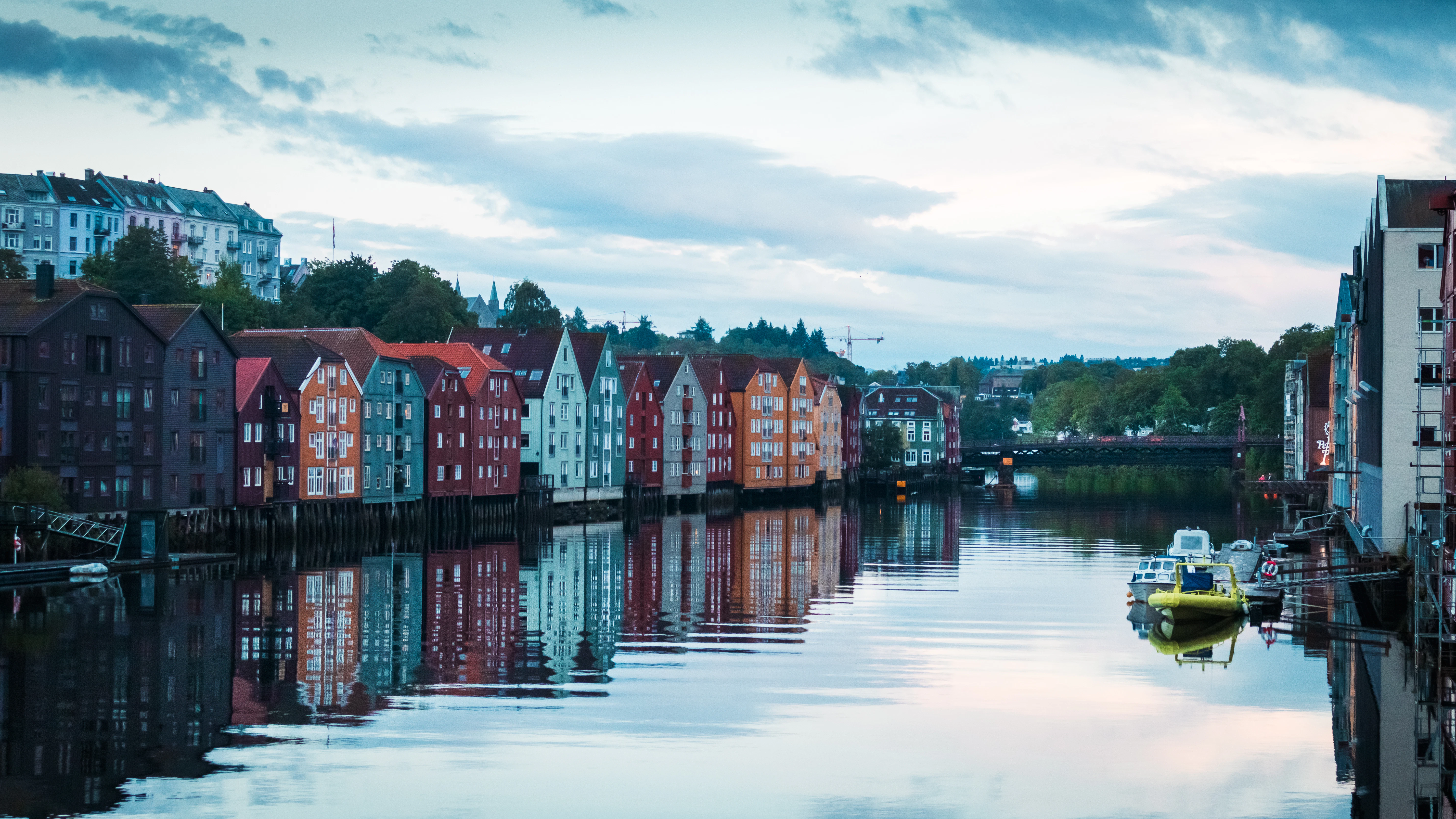 A body of water with a bunch of buildings in the background