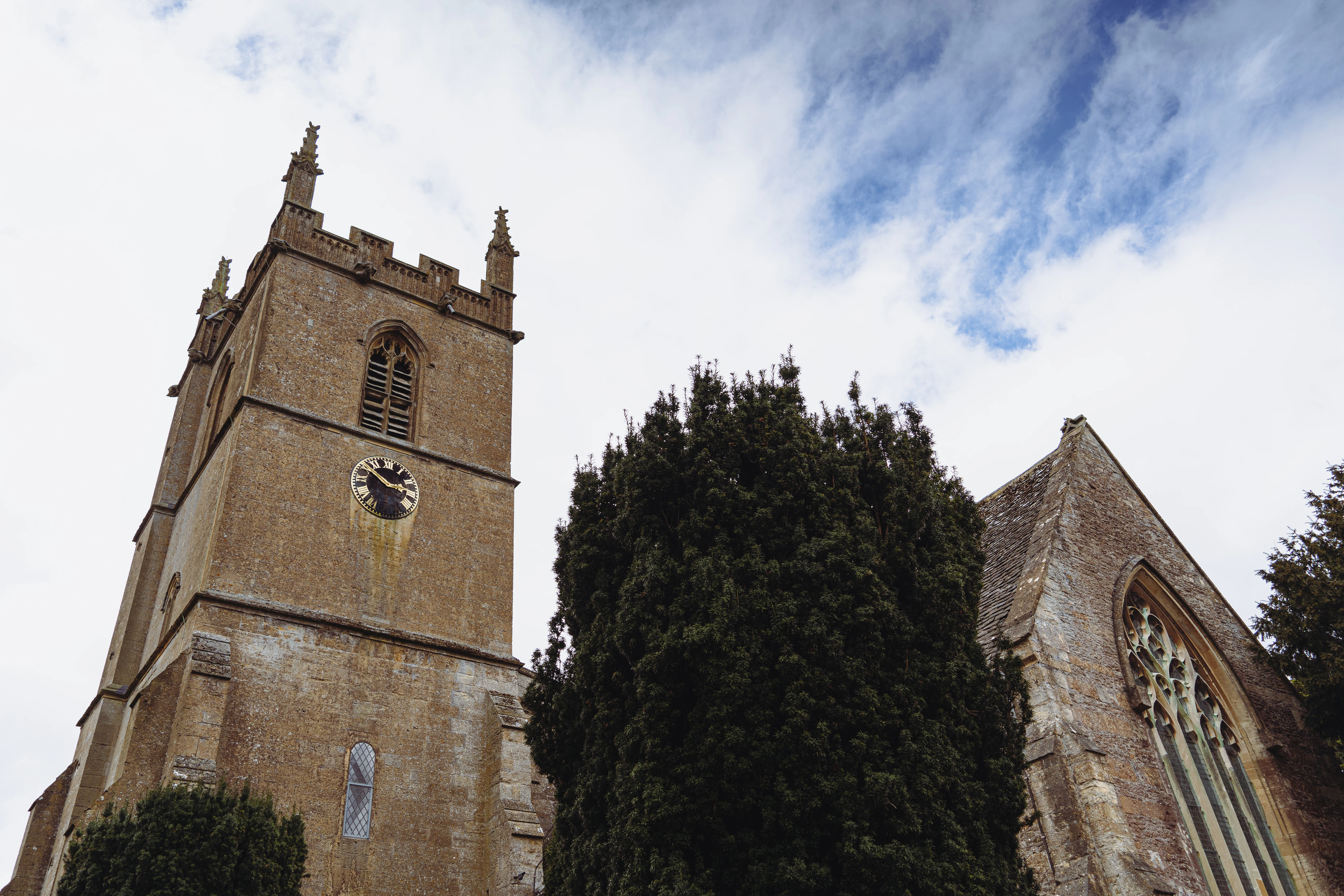 a tall tower with a clock on the side of it