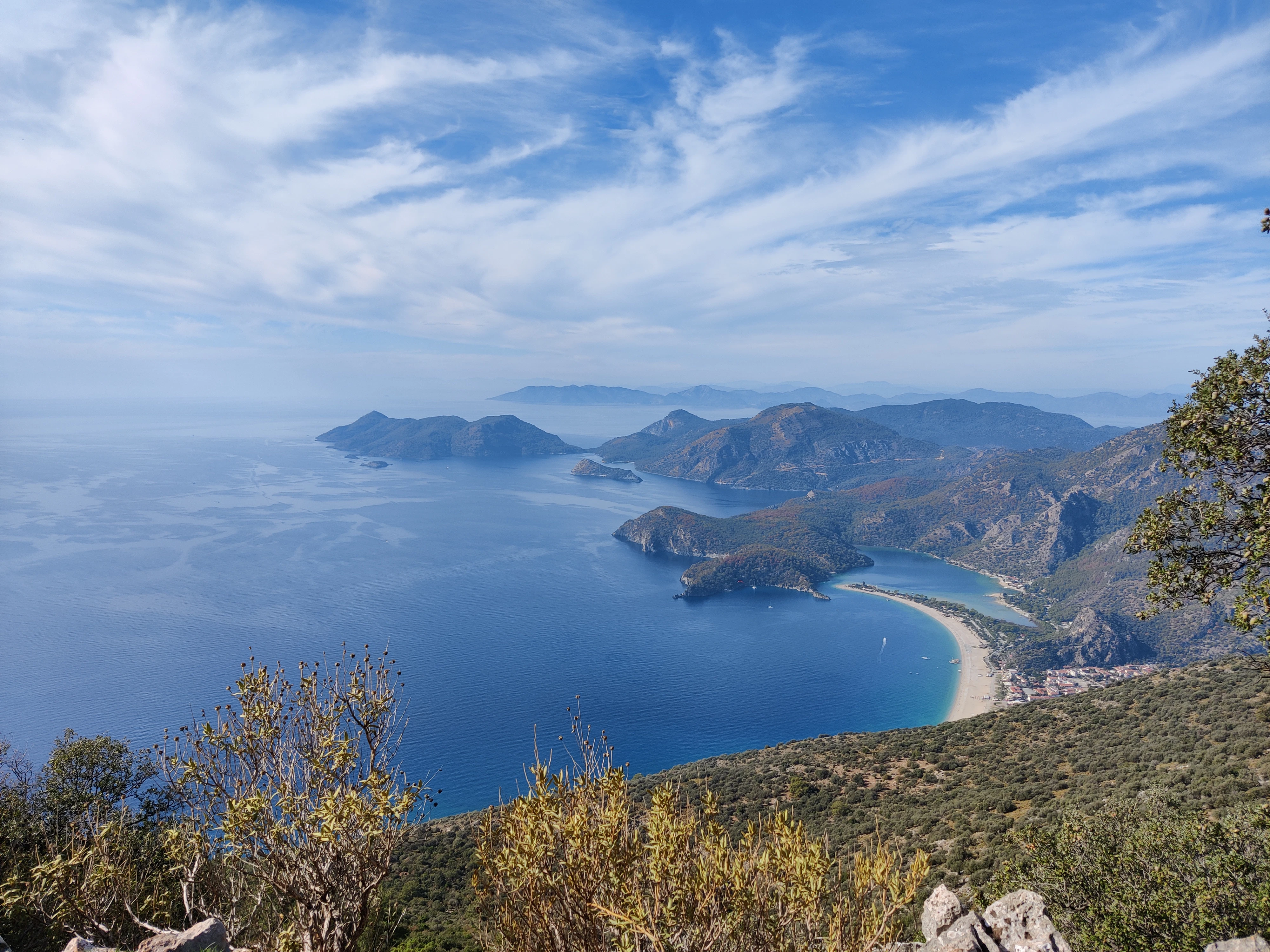 a scenic view of a beach and a body of water