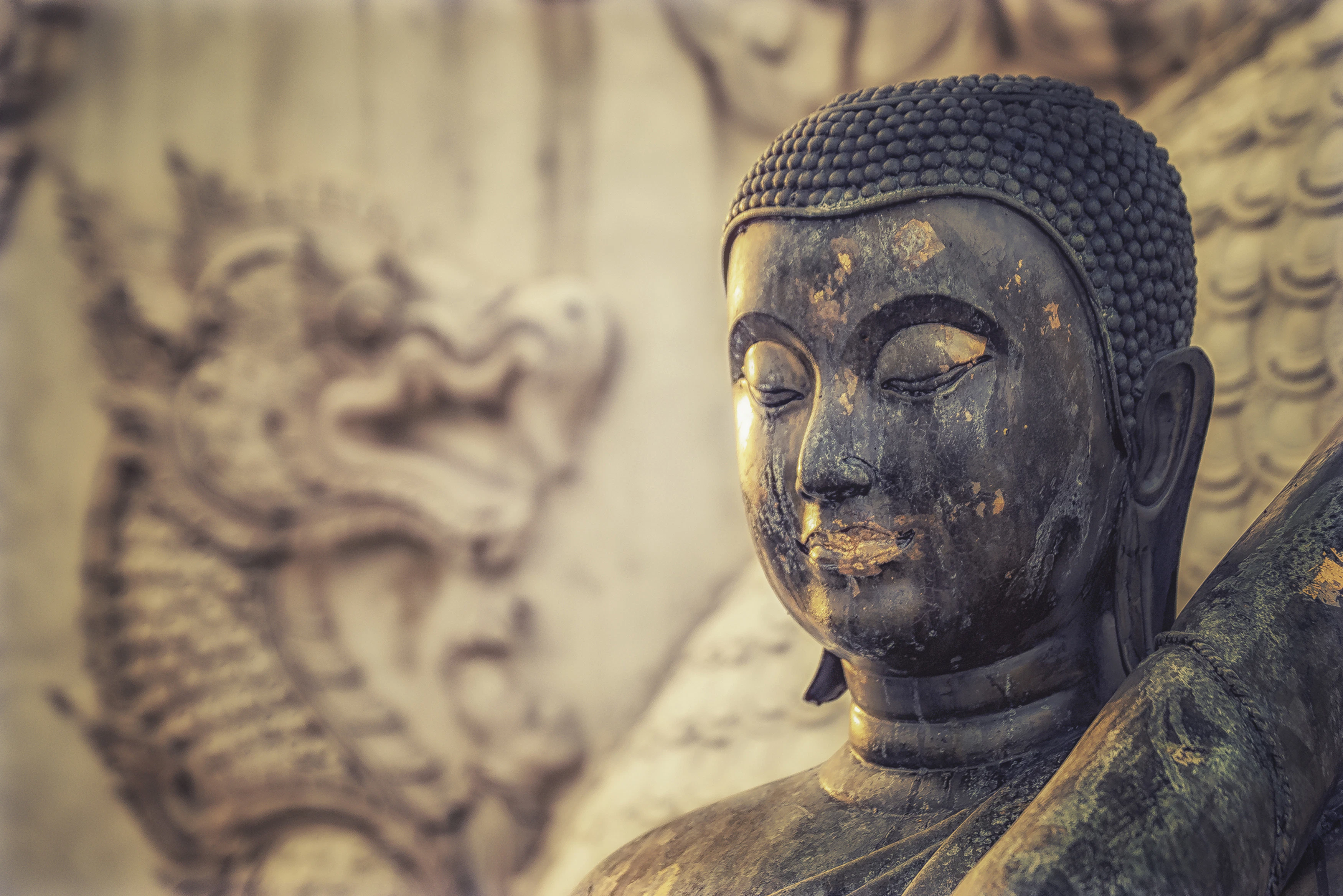 black and gold buddha statue