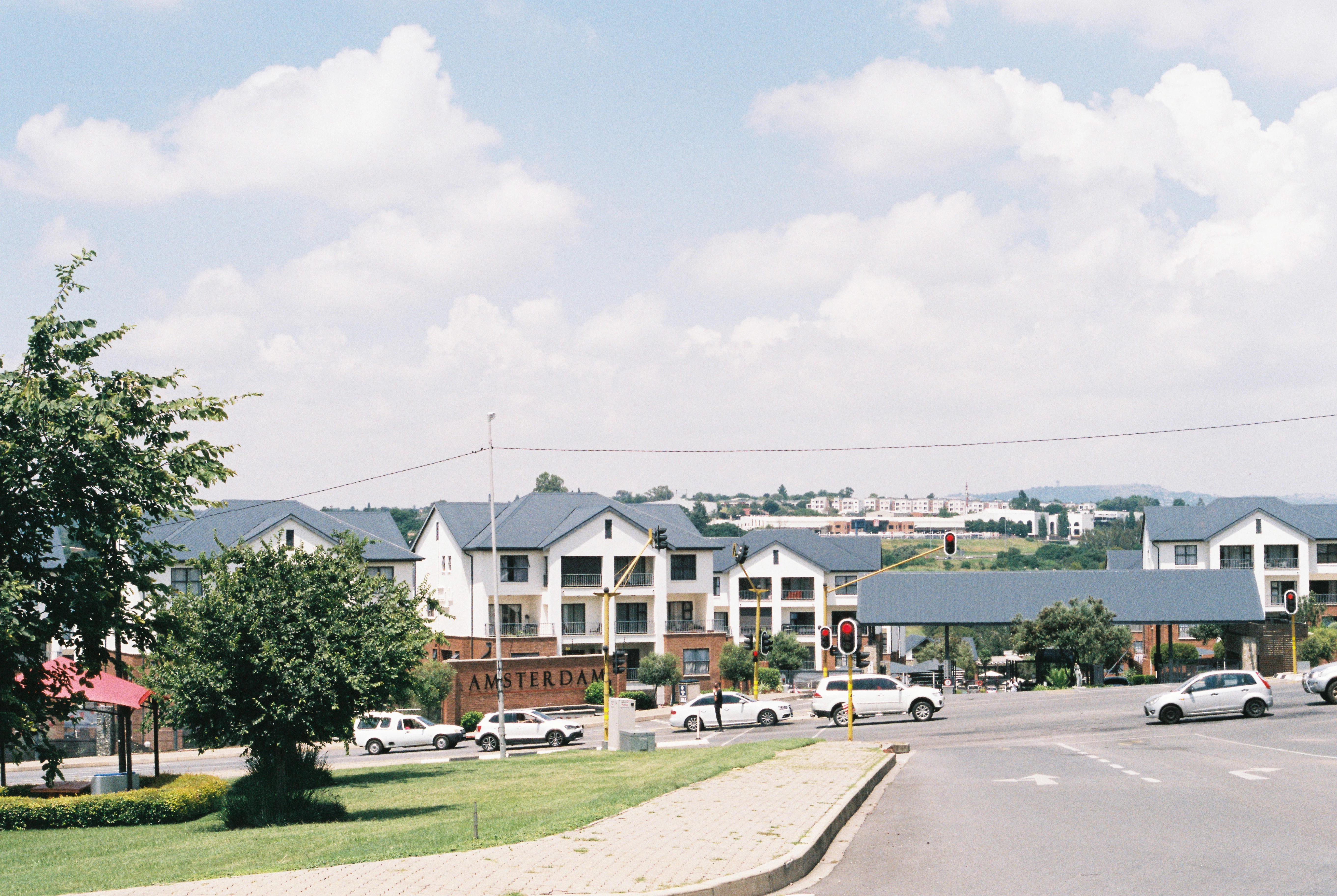 a street with cars parked on the side of it