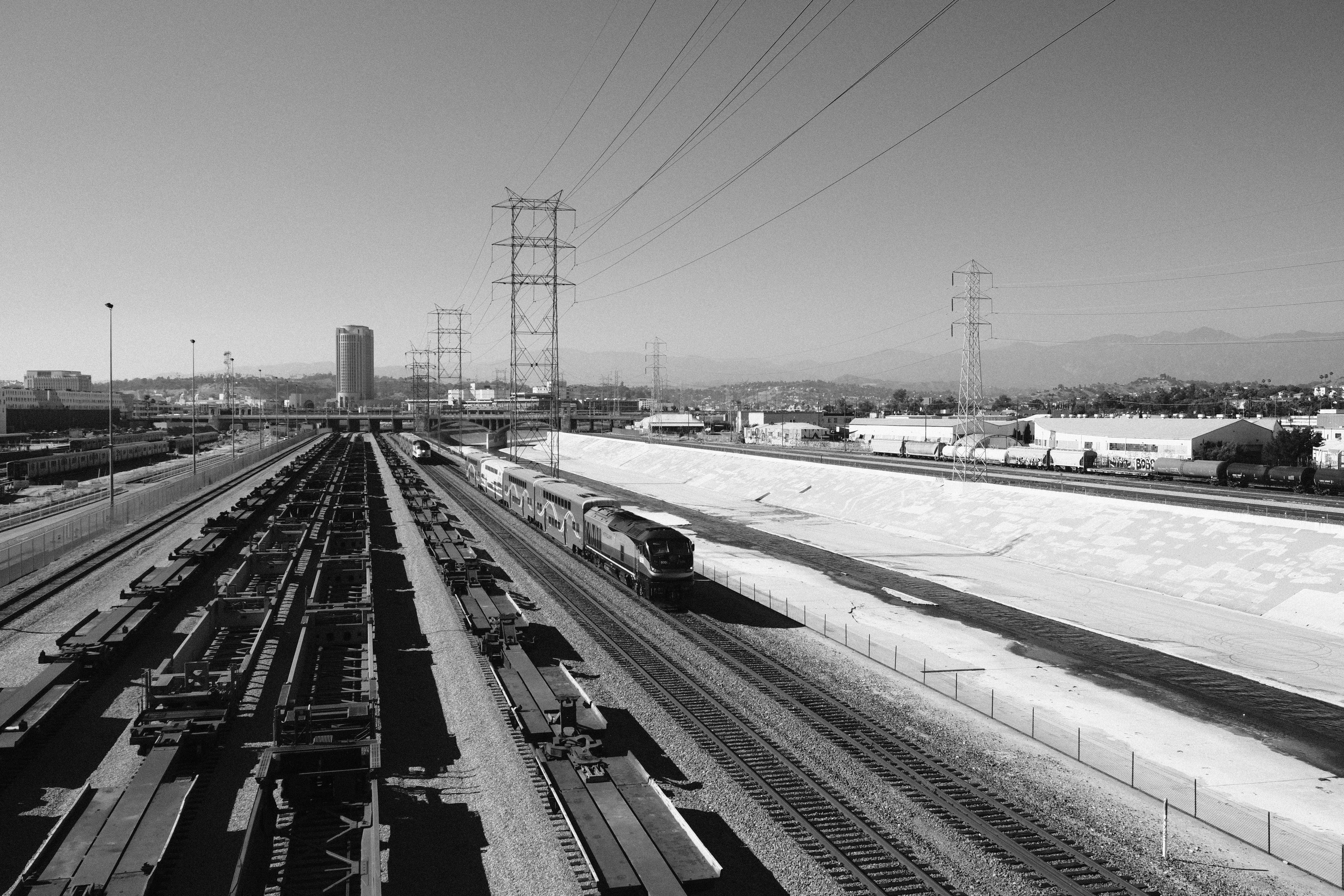 a black and white photo of a train yard
