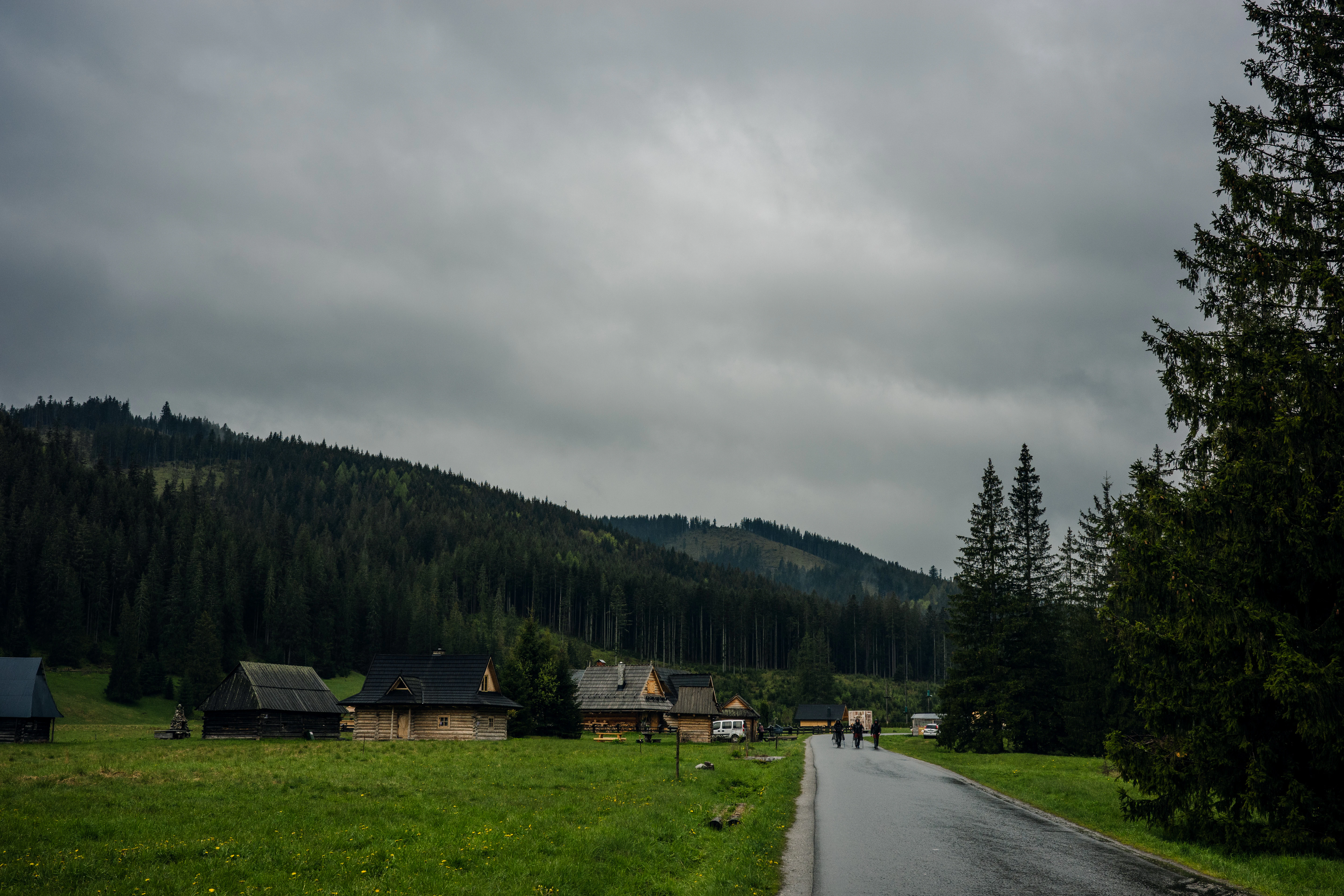 A road leads through a green valley.