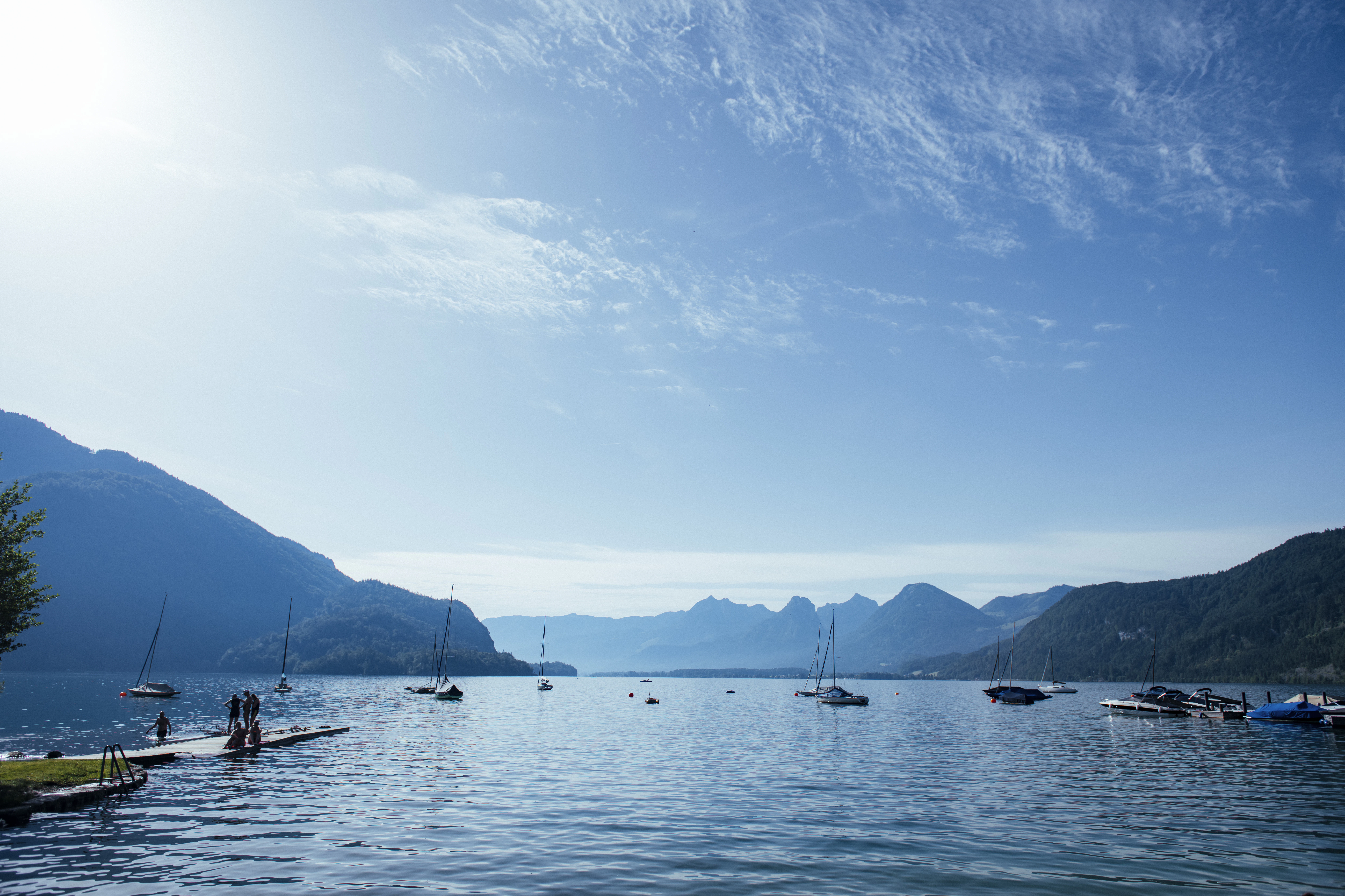 a group of people rowing boats