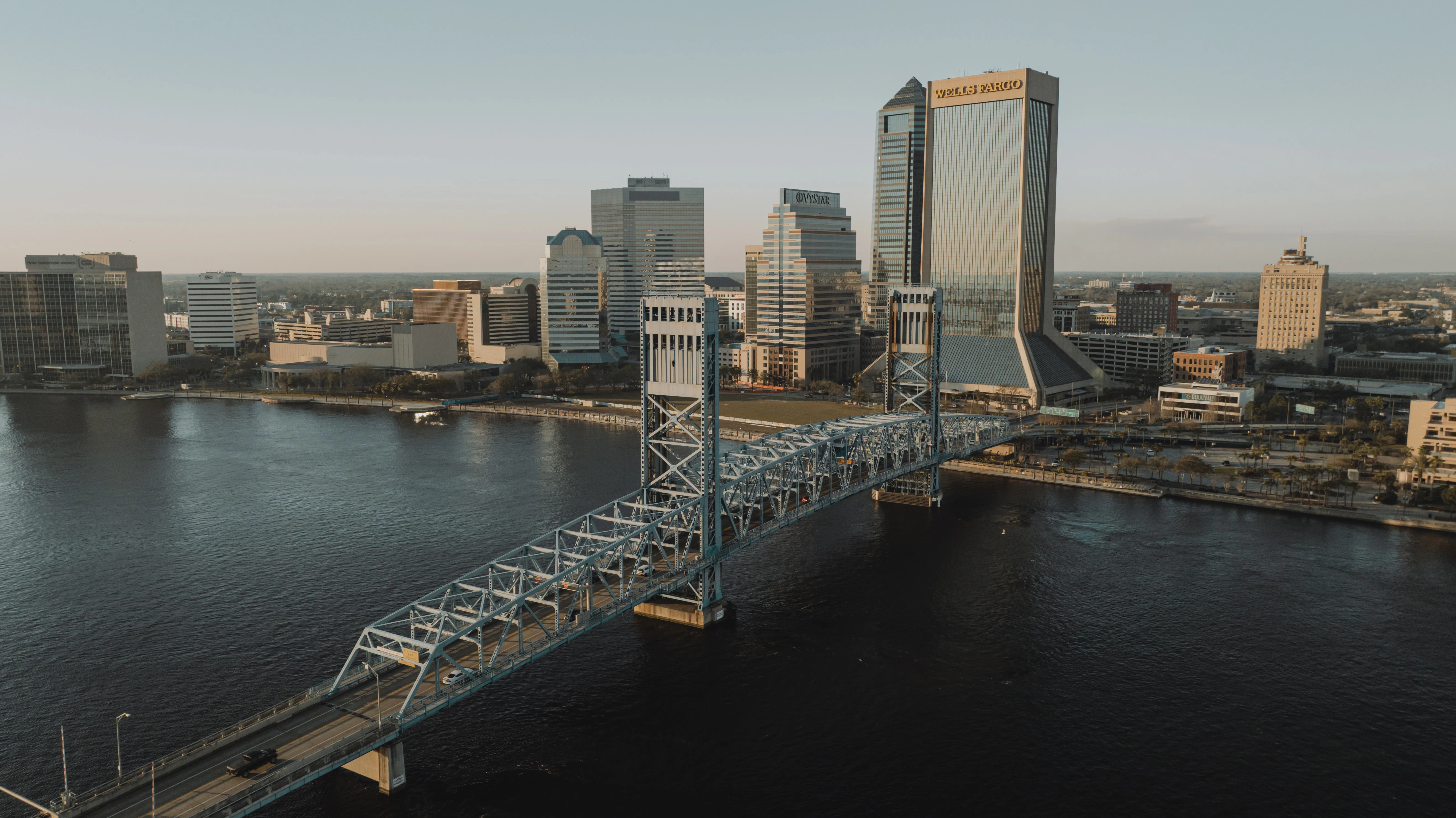 an aerial view of a city and a bridge