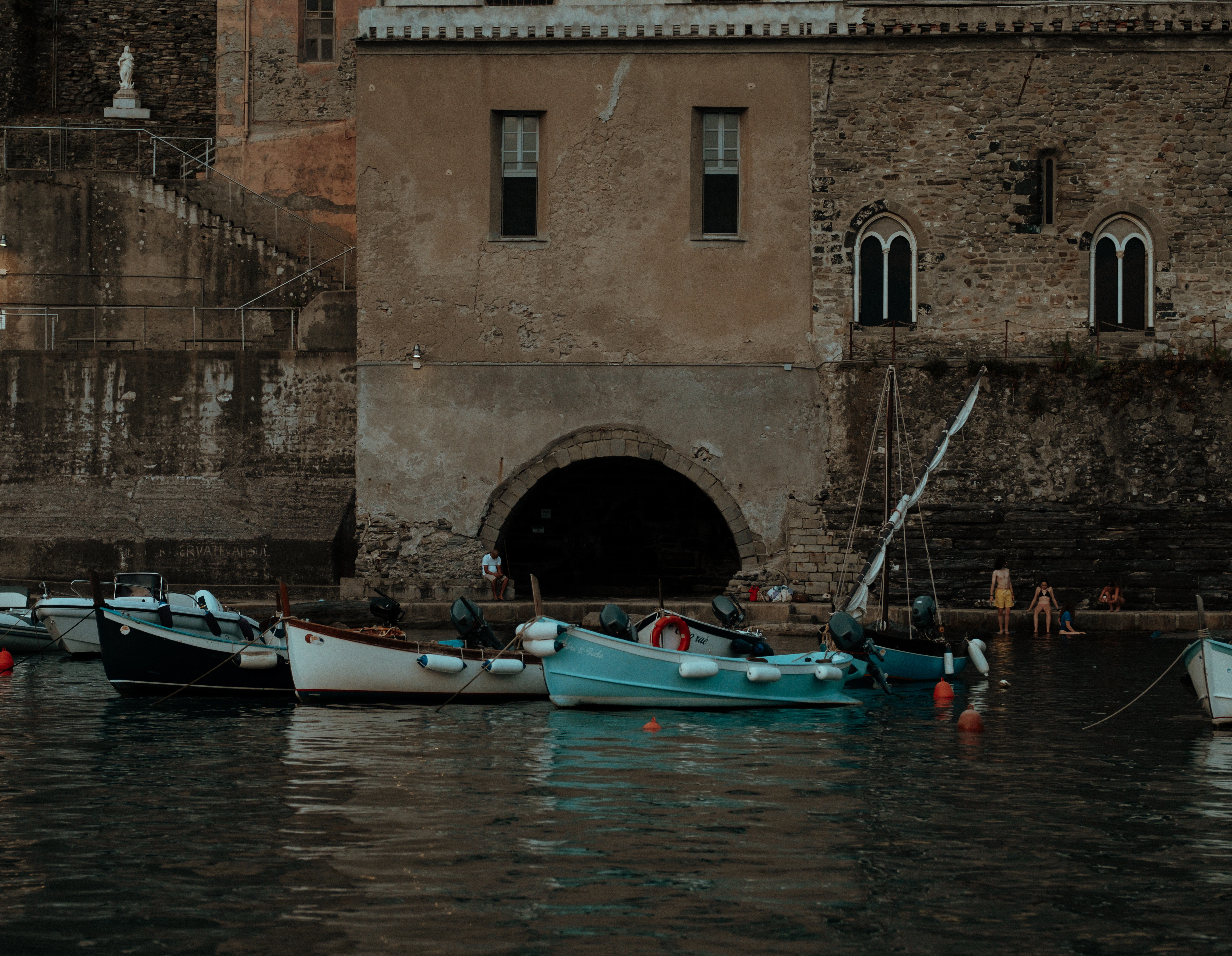 A group of boats floating in a body of water