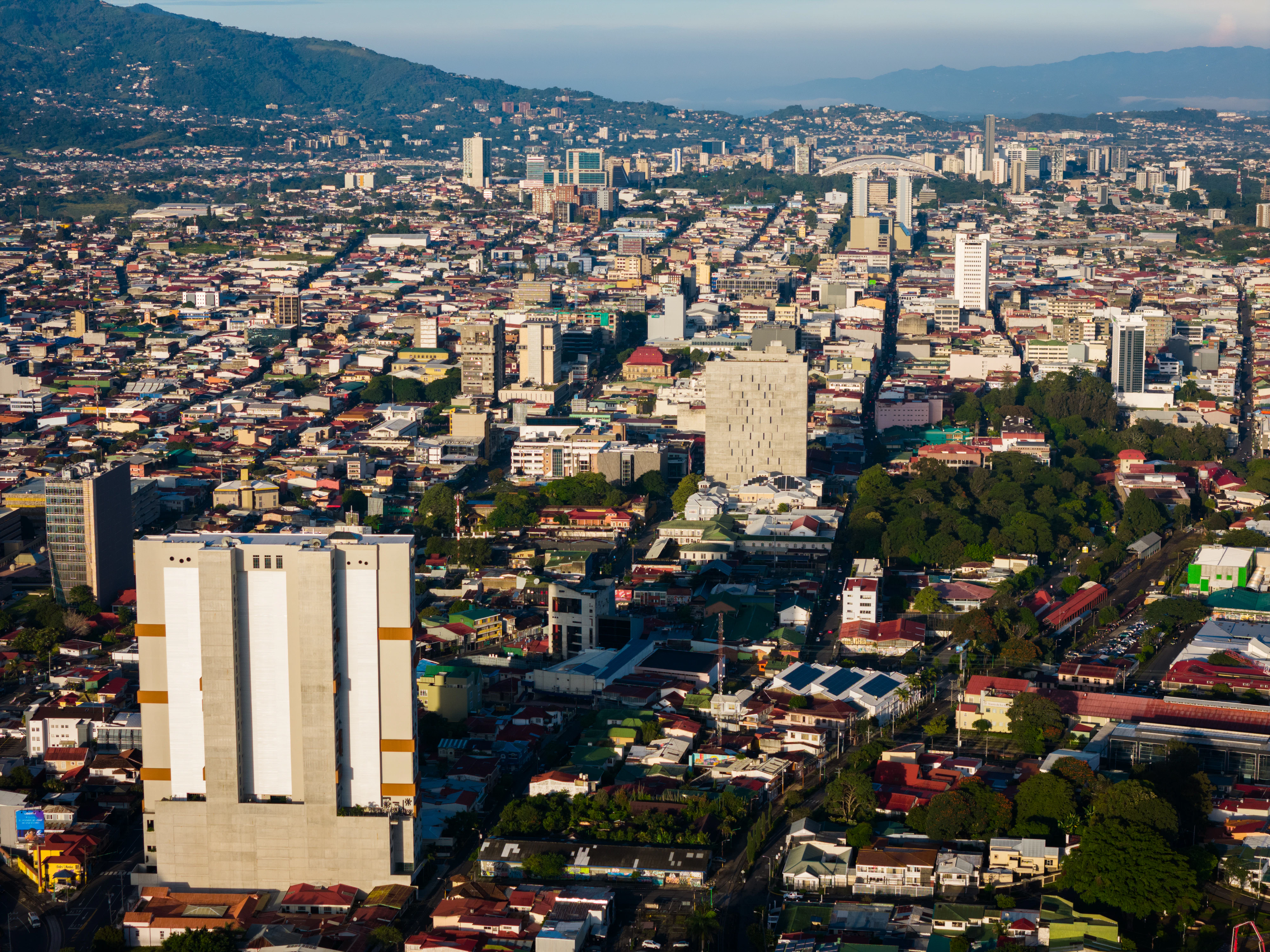 an aerial view of a city with tall buildings