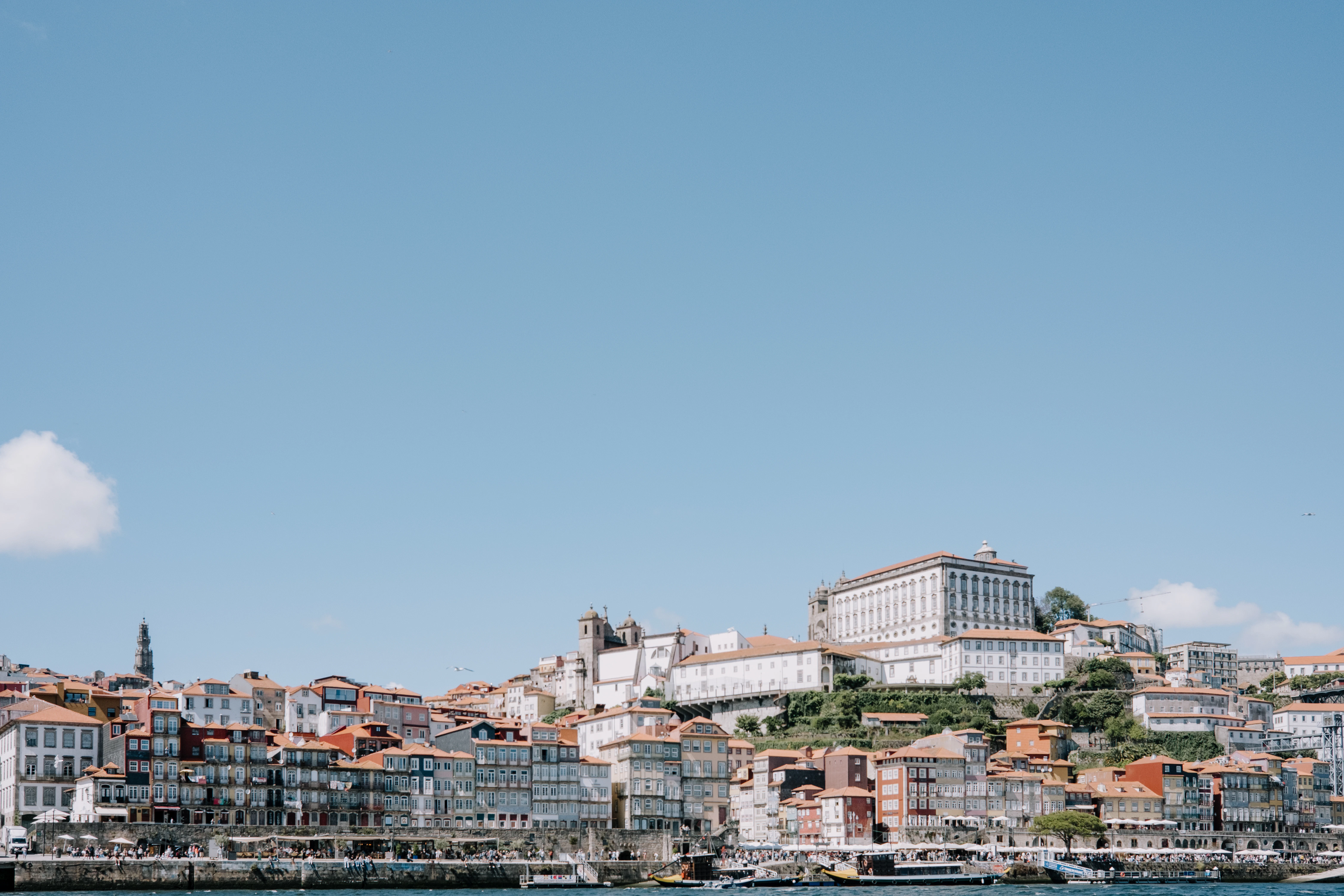 A large body of water with a city in the background