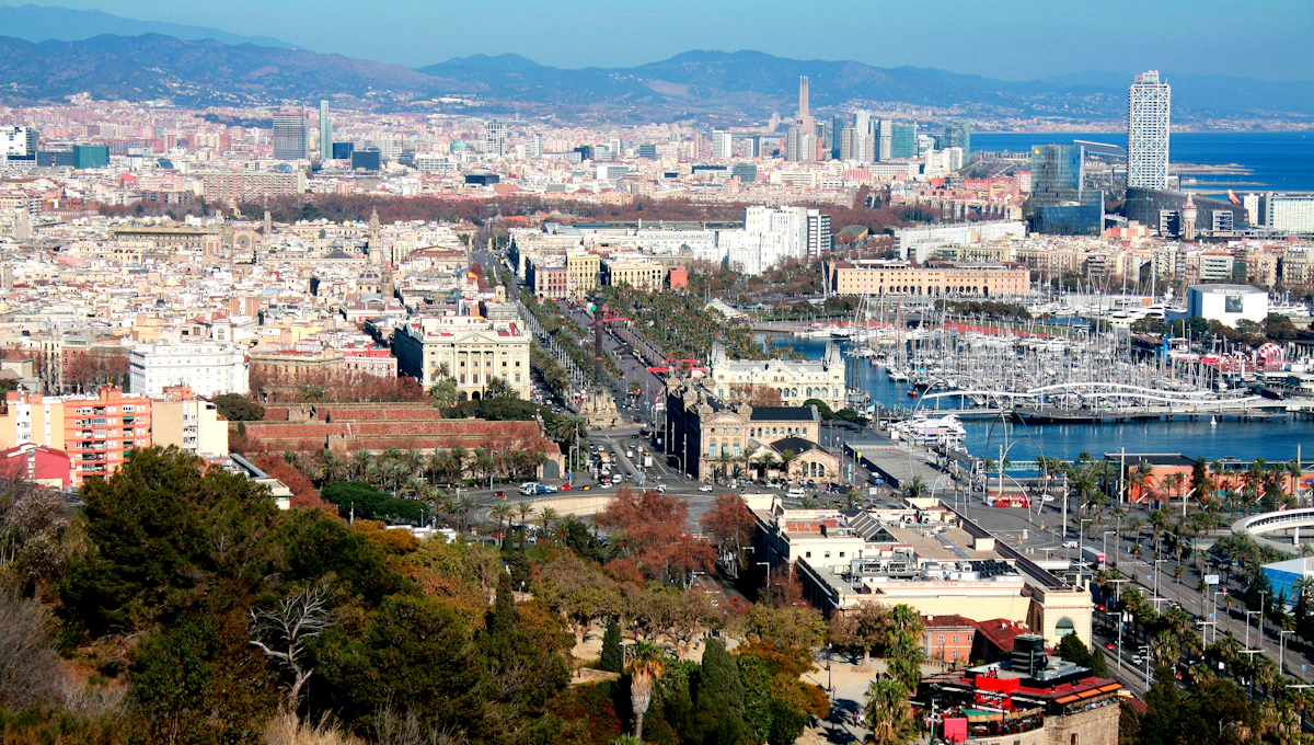Panoramic view of a bustling city with a harbor.