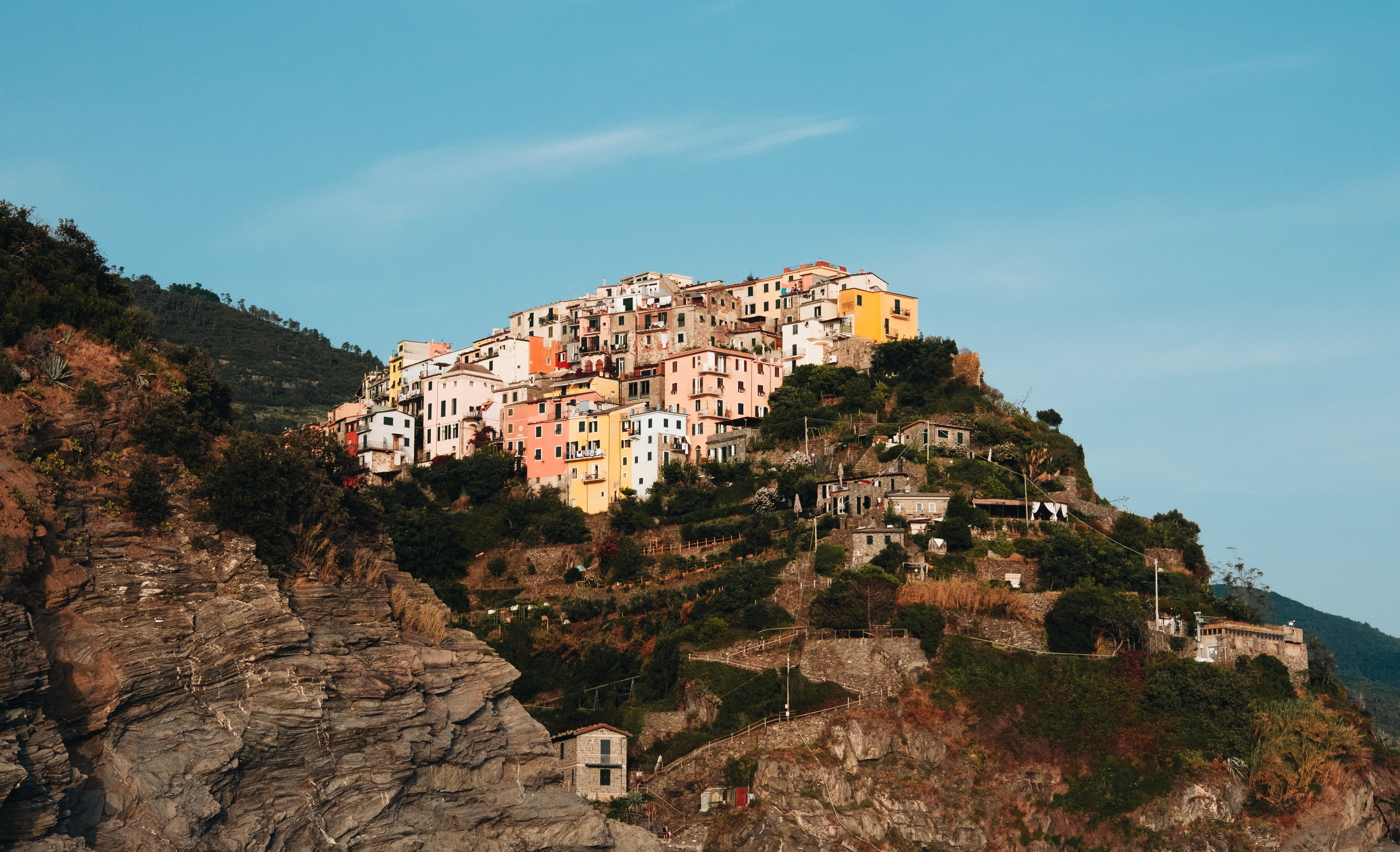 A hill with a bunch of buildings on top of it